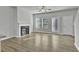 Bright living room with fireplace, hardwood floors, and access to patio at 4336 Mallory Ct, Union City, GA 30291