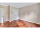 Simple bedroom with hardwood floors and a double door closet at 1450 Grovehurst Dr, Marietta, GA 30062