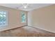 Spacious bedroom with two windows and carpet at 1450 Grovehurst Dr, Marietta, GA 30062