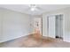 Bright bedroom with ceiling fan and access to hallway at 1450 Grovehurst Dr, Marietta, GA 30062