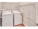 Laundry room with washer, dryer, and ample shelving at 1450 Grovehurst Dr, Marietta, GA 30062