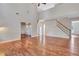 Two-story living room with hardwood floors and staircase at 1450 Grovehurst Dr, Marietta, GA 30062