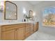 Elegant bathroom with dual vanities, quartz countertops, and marble flooring at 1565 Pineview Terrace Sw, Atlanta, GA 30311