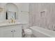 Modern bathroom with white vanity, bathtub, and stylish tile at 1565 Pineview Terrace Sw, Atlanta, GA 30311