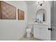 Stylish bathroom with white vanity, hexagon tile floor, and arched mirror at 1565 Pineview Terrace Sw, Atlanta, GA 30311