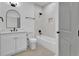 Clean bathroom, featuring a white vanity and bathtub at 1565 Pineview Terrace Sw, Atlanta, GA 30311