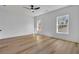 Well-lit bedroom with hardwood floors and ceiling fan at 1565 Pineview Terrace Sw, Atlanta, GA 30311