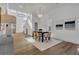 Open concept dining area with a table for four, hardwood floors, and large windows at 1565 Pineview Sw Ter, Atlanta, GA 30311