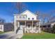 Two-story modern home with gray brick, front porch, and landscaped lawn at 1565 Pineview Terrace Sw, Atlanta, GA 30311