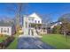 Two-story home with gray brick and white accents, front porch, and landscaped lawn at 1565 Pineview Terrace Sw, Atlanta, GA 30311