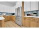 Modern kitchen with light wood cabinets, quartz countertops, and stainless steel appliances at 1565 Pineview Terrace Sw, Atlanta, GA 30311