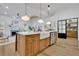 Open concept kitchen with island, farmhouse sink, and stainless steel appliances at 1565 Pineview Sw Ter, Atlanta, GA 30311