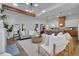 Open concept living room with a modern aesthetic, exposed beams, and views to the kitchen at 1565 Pineview Sw Ter, Atlanta, GA 30311