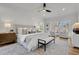 Bright main bedroom with hardwood floors, shiplap and seating area at 1565 Pineview Terrace Sw, Atlanta, GA 30311