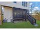 Modern screened porch with dark wood railings and steps at 1565 Pineview Terrace Sw, Atlanta, GA 30311