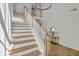 Modern staircase with wooden treads and white railings at 1565 Pineview Terrace Sw, Atlanta, GA 30311