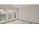 Neutral bedroom with carpet, a large window, and ample natural light at 2428 Bridlewood Se Dr # 24, Atlanta, GA 30339