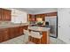 Spacious kitchen with island, stainless steel appliances, and wood cabinets at 2428 Bridlewood Se Dr # 24, Atlanta, GA 30339