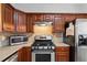 Kitchen with stainless steel appliances and wood cabinets at 2428 Bridlewood Se Dr # 24, Atlanta, GA 30339