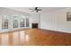 Bright living room with hardwood floors, fireplace, French doors, and large windows at 2428 Bridlewood Se Dr # 24, Atlanta, GA 30339