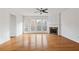 Bright living room boasts hardwood floors, fireplace, and large windows at 2428 Bridlewood Se Dr # 24, Atlanta, GA 30339