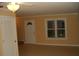 Bright living room with tile floors and neutral walls at 306 Flagstone Way # 306, Austell, GA 30168