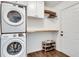 Bright laundry room featuring stackable washer and dryer at 3935 Admiral Dr, Chamblee, GA 30341