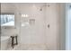 Walk-in shower with marble tile and glass enclosure at 3935 Admiral Dr, Chamblee, GA 30341