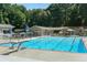 Community swimming pool with diving board and lounge area at 3935 Admiral Dr, Chamblee, GA 30341