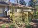 Wooden deck and stairs leading to a wooded backyard at 425 Hilderbrand Dr, Sandy Springs, GA 30328