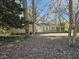 House exterior showcasing a light green painted home with a large yard at 425 Hilderbrand Dr, Sandy Springs, GA 30328