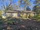 Ranch house with a wooden deck and storage shed at 425 Hilderbrand Dr, Sandy Springs, GA 30328