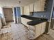 Small kitchen with white cabinets and dark countertops at 425 Hilderbrand Dr, Sandy Springs, GA 30328