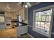 Kitchen features white cabinets, black countertops and a breakfast area at 425 Hilderbrand Dr, Sandy Springs, GA 30328