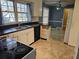 Kitchen with white cabinets, black countertops, and a view of the backyard at 425 Hilderbrand Dr, Sandy Springs, GA 30328