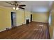 Bright living room with hardwood floors, fireplace, and large windows at 425 Hilderbrand Dr, Sandy Springs, GA 30328