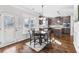 Bright breakfast nook with a round table and chairs, hardwood floors at 502 Starling View Cir, Grayson, GA 30017