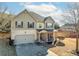 Two-story house with attached garage and rocking chairs on the porch at 502 Starling View Cir, Grayson, GA 30017