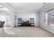 Living room with carpet, large window, and TV stand at 502 Starling View Cir, Grayson, GA 30017