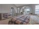 Bright bedroom with a king-size bed and built-in shelving at 6460 Dove Dr, Loganville, GA 30052