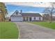 House exterior showcasing a white facade and landscaping at 6460 Dove Dr, Loganville, GA 30052