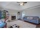 Living room with fireplace, built-in shelving, and hardwood floors at 6460 Dove Dr, Loganville, GA 30052