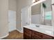 Clean bathroom with vanity, mirror, and shower at 845 Nevis Way, Mcdonough, GA 30253