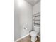 Small half bathroom with toilet and shelving at 845 Nevis Way, Mcdonough, GA 30253