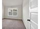 Bright bedroom with neutral walls, carpet flooring, and a window with blinds at 845 Nevis Way, Mcdonough, GA 30253