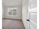 Bright bedroom with neutral walls and carpet at 845 Nevis Way, Mcdonough, GA 30253