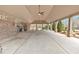 Covered patio area with ceiling fan and picnic tables at 845 Nevis Way, Mcdonough, GA 30253