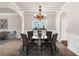 Bright dining room featuring a chandelier and seating for four at 845 Nevis Way, Mcdonough, GA 30253