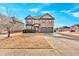 Two-story brick home with a red door and landscaping at 845 Nevis Way, Mcdonough, GA 30253