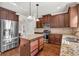 Open concept kitchen with island and stainless steel appliances at 845 Nevis Way, Mcdonough, GA 30253